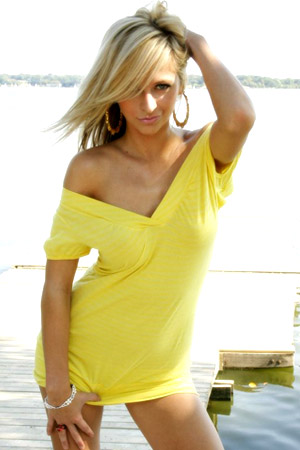 Blonde babe London Hart shows her hot body in a tight yellow dress